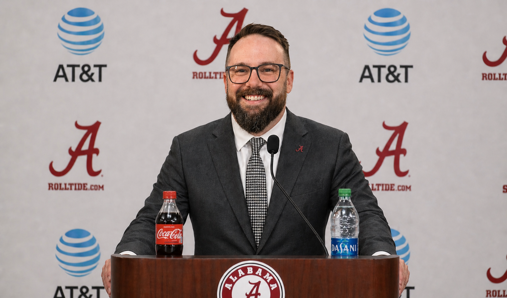 Rev Zac Head stands behind the press conference podium used by the coaching staff of the University of Alabama football program.